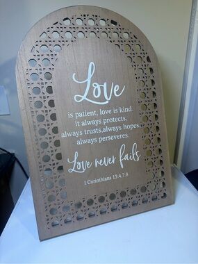 Wooden 'Love Never Fails' Decorative Wall Plaque in Natural Brown